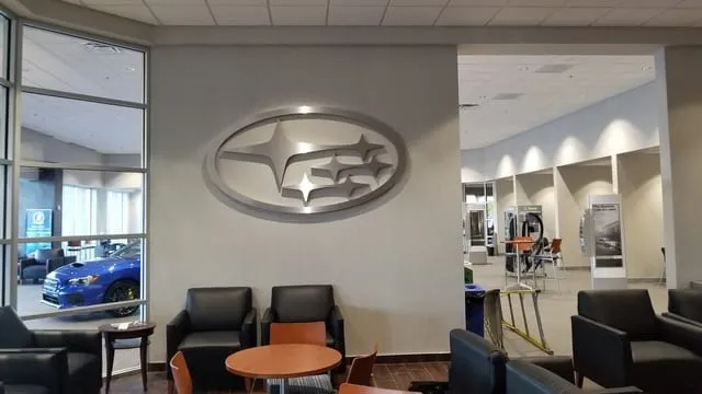 Custom millwork at an auto dealership by Pio Custom Cabinetry