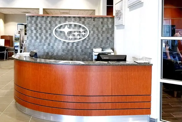 Custom millwork at an auto dealership by Pio Custom Cabinetry