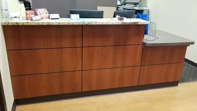 Custom millwork at an auto dealership by Pio Custom Cabinetry