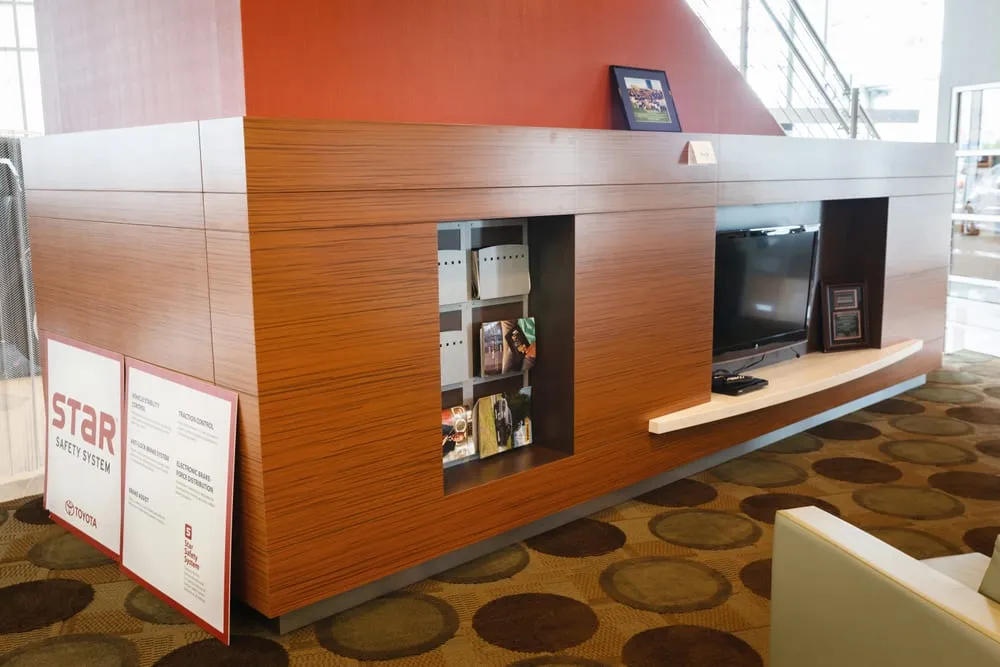 Custom millwork at an auto dealership by Pio Custom Cabinetry