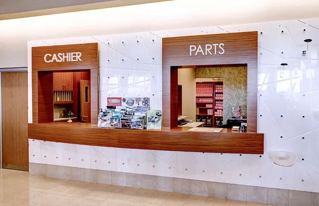 Custom millwork at an auto dealership by Pio Custom Cabinetry