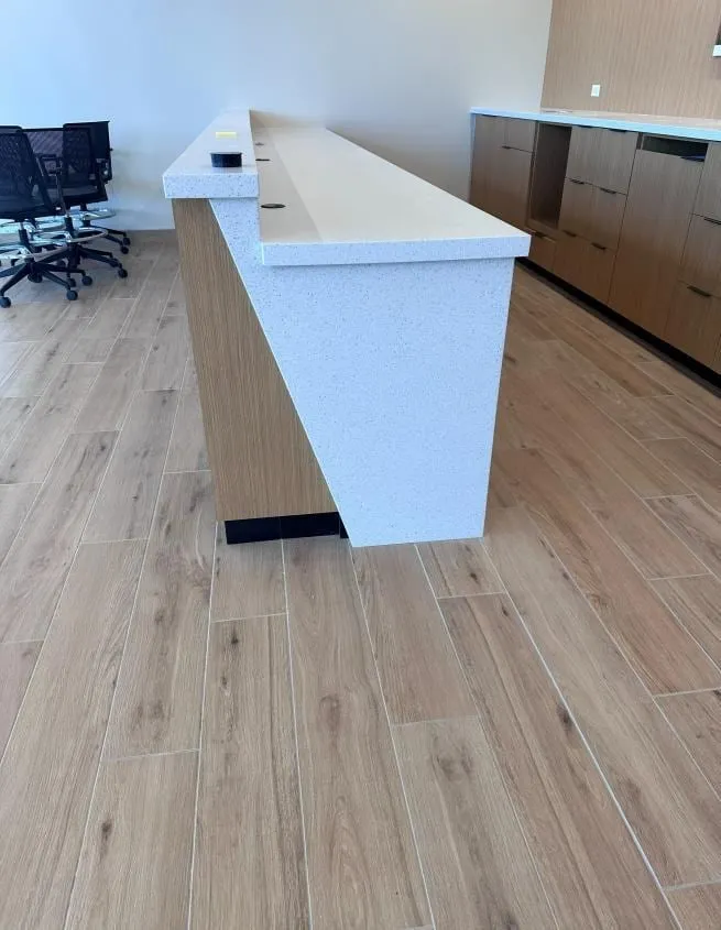 Custom millwork at an auto dealership by Pio Custom Cabinetry