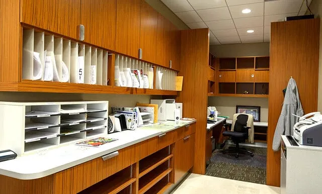 Custom corporate office millwork by Pio Custom Cabinetry