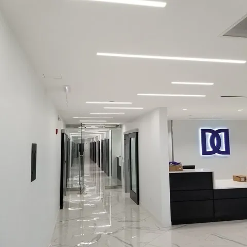 Medical office corridor with reception millwork and exam-room doors