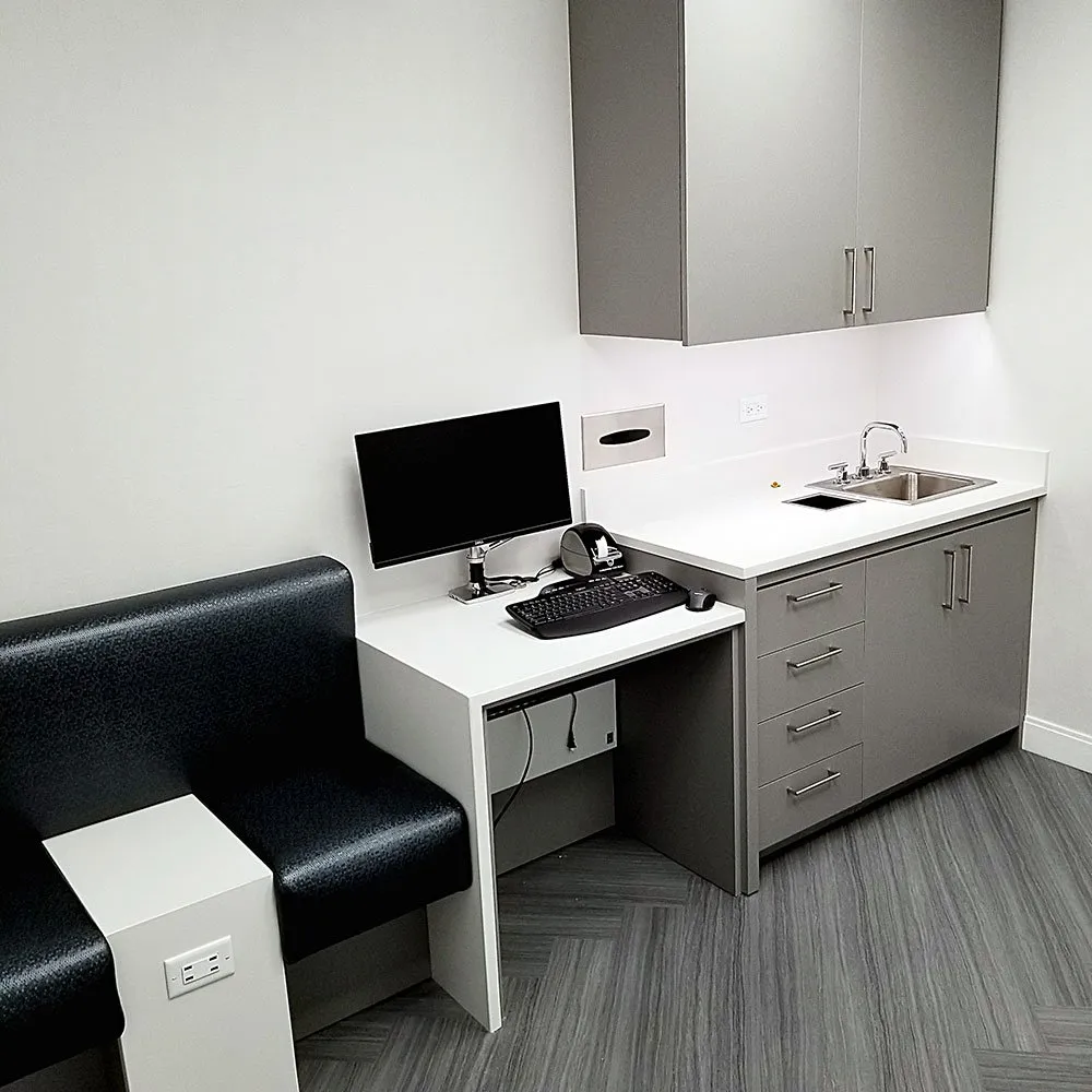 Medical exam room with custom casework and integrated sink
