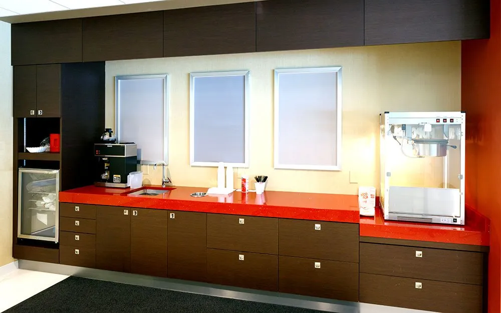 Plastic-laminate break-room casework with red accent counter