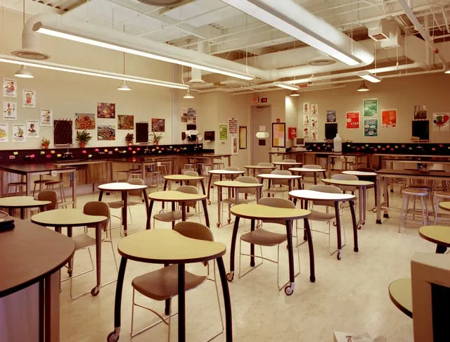School science classroom with plastic-laminate lab casework and laminate-topped worktables