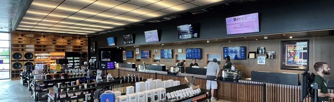 Long custom service counter with digital menu wall