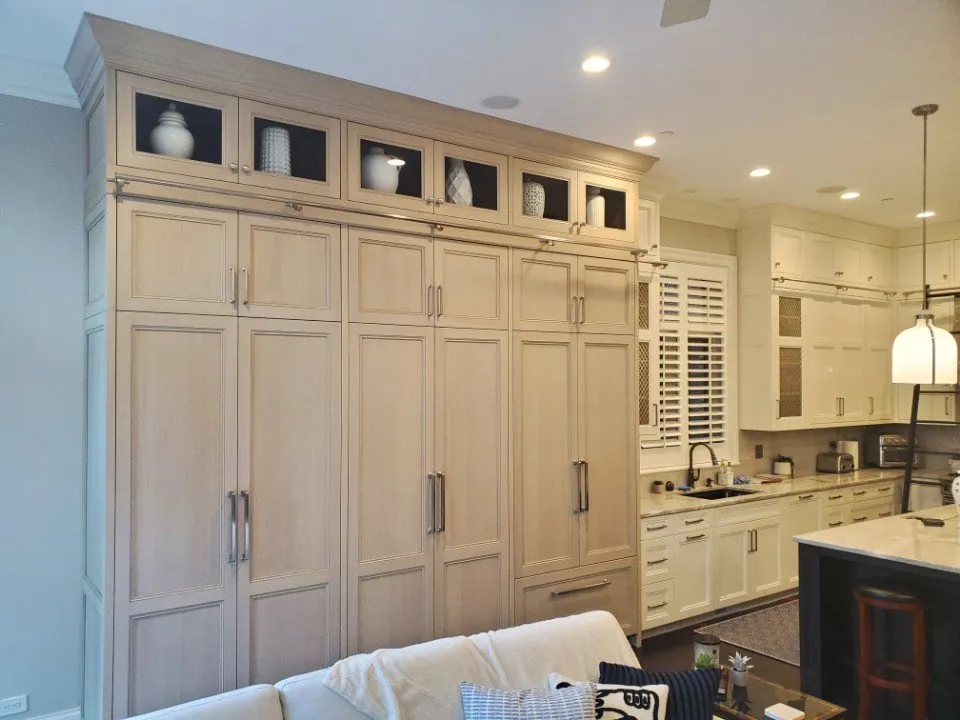 Custom white shaker kitchen with paneled appliances