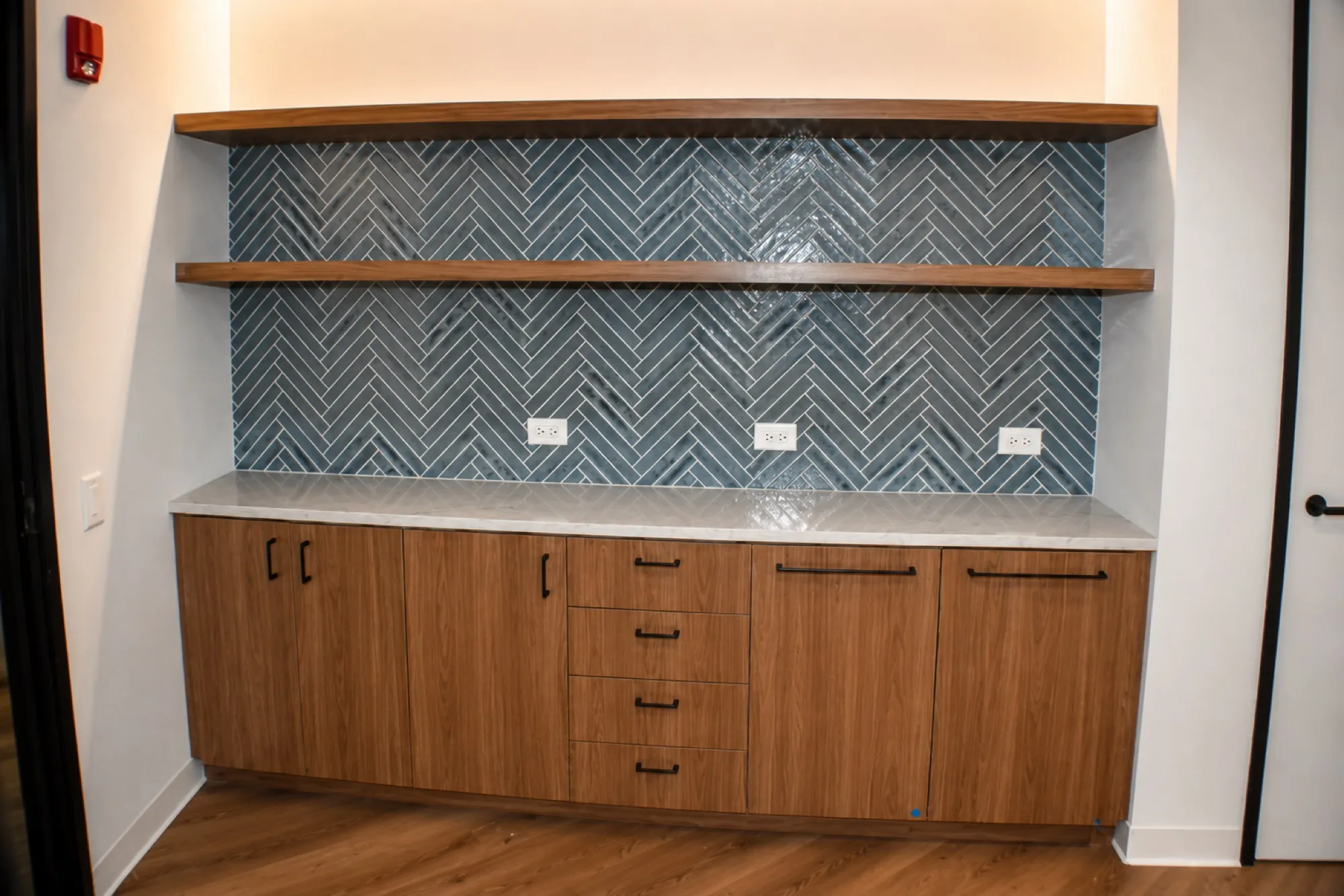 Custom corporate office millwork by Pio Custom Cabinetry